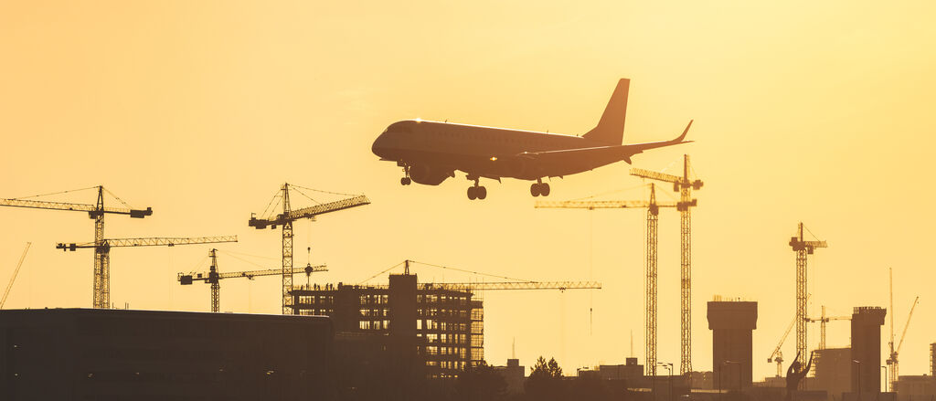 Airplane landing at sunset at London City airport